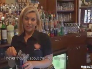 Bartender sucks member behind counter