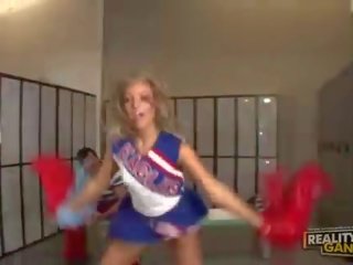 Cute blonde teen cheerleader talking with her teacher